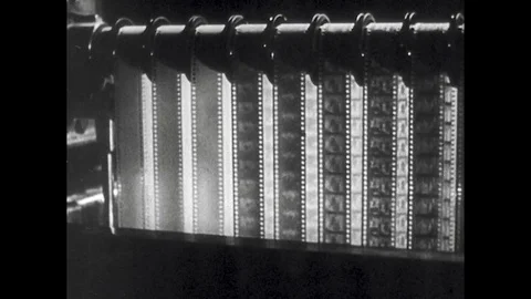 1940s: Celluloid Ribbon Running through Movie Projector Stock Footage 74873492