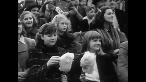 A 1940's circus act kicks off with trick dogs, stunt roller skaters, and various Stock Footage 79518337