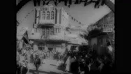 1940S: City.  People Line Streets.  Man Reads From Paper.  Building.  Stock Footage