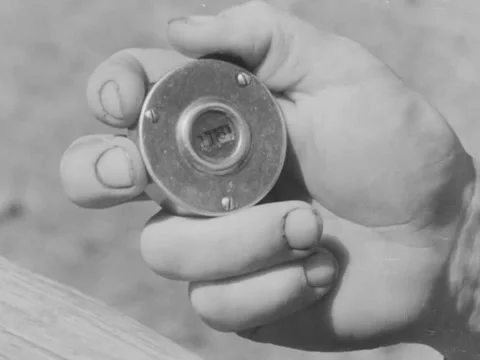 1940s: Close-up of hand using counter Video stock 229320661