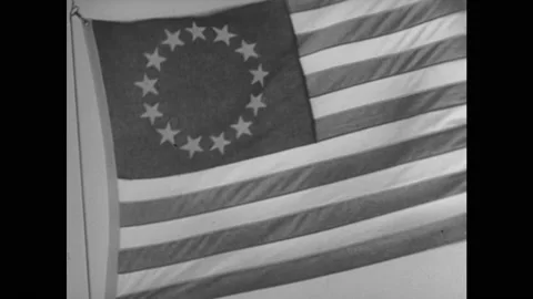 1940s: Colonial U.S. flag. Map of Colonial United States. Wagon train going Stock Footage 140917042
