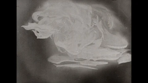 1940s: Comet hits earth. Explosion. Earth spins around. Image of globe flattens Stock Footage