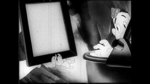 1940s: Devil Adolf Hitler holds mirror up to Private Snafu. Private Snafu sees Stock Footage 89766989