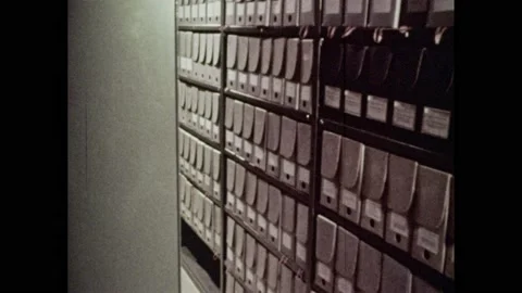 1940s: Document boxes sit on library stack shelves. Label on presidential papers 스톡 동영상 159798947