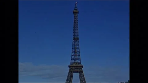 1940s: Eiffel Tower, car driving past Eiffel Tower, taking elevator up Eiffel Stock Footage 167083591
