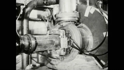 1940s: Electron accelerator sits on table in lab. Large electrostatic generator Stock Footage 169234179