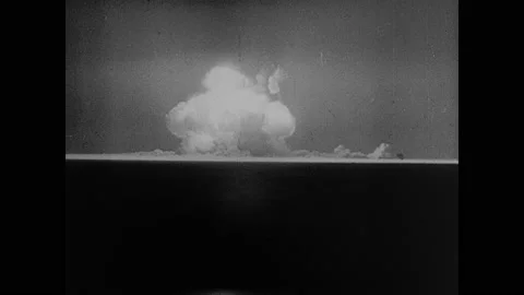 1940s: Explosion of atomic bomb. Fire burns. Large industrial facility. Factory. Stock Footage 158442754