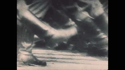 1940s: Explosion blast. Marching feet. RAF pilots run to planes. Soldiers jump Video stock 194464199