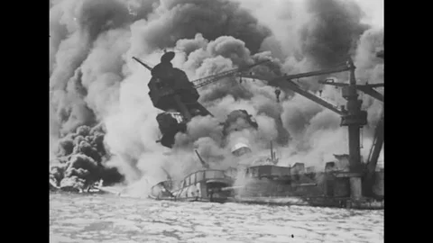 1940s: flames, clouds, and smoke around sinking ship in sea. Stock Footage 75153698