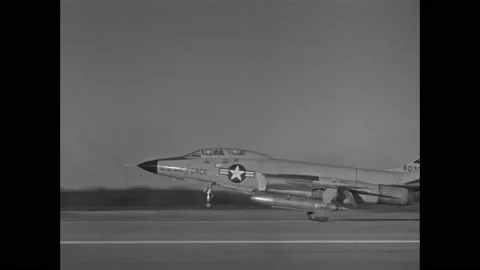 1940s: Flying in jet, looking at jets in formation. Jet ejects parachute behind 스톡 동영상 158448158