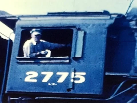 1940s Footage of an Engineer Sitting at the Window of a Steam Locomotive Video stock 335894764