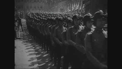 1940s - Footage of Nazi soldiers marching and Hitlers supporters cheering is Stock Footage