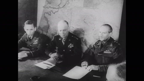 1940s: General Eisenhower sits at table with other military officers. Cannons Stock Footage 137412154