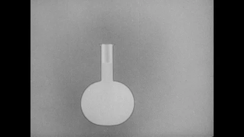 1940s: Graphic of liquid in bottle, piston moves up and down in neck of bottle. Vidéo 94223286