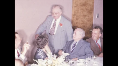 1940s: Guest of honor circulates in function room full of smiling guests. 스톡 동영상 95850023