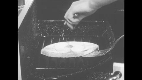 1940s: Hands flip fish in broiler, put oil on fish, close oven. 스톡 동영상 79190515