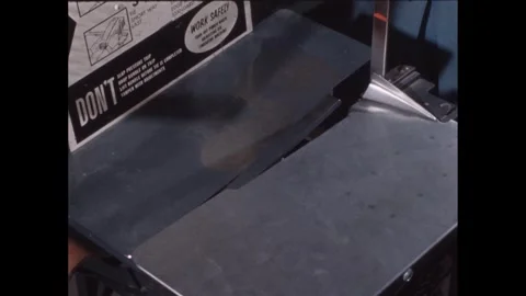 1940s: Hands place envelope stack on and off scale in post office. Video stock 240682134