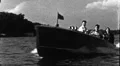 1940s Happy People Zoom By in Boat Wave Hello Vintage Old Film Home Movie HD Footage