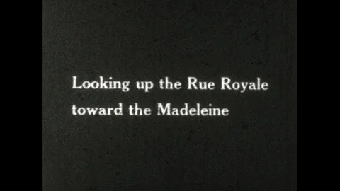 1940s: Intertitle "Looking up the Rue Royale toward the Madeleine". Fountain Stock Footage 120796914