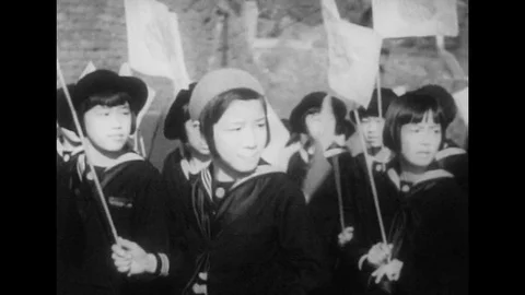 1940s: Japanese girls with flags / Rear view of soldiers saluting crowd / Crowd Stock Footage