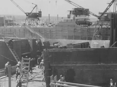 1940s: Large ship under construction Stock Footage 231185346