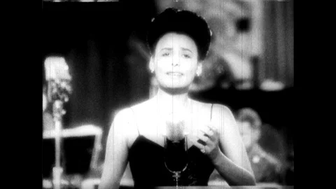 1940s:  Lena Horne concludes singing "That Man I Love". Animation credits for Stock Footage