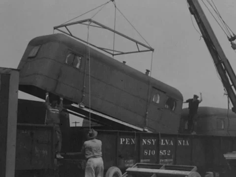 1940s: Lifting chassis out of train Stock Footage 231184069