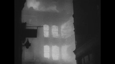 1940s: London buildings on fire. People sleep in underground station. Ladies Stock Footage