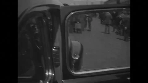 1940s: Luggage is being loaded onto a train. A person is standing by, seemingly Stock Footage 279925829