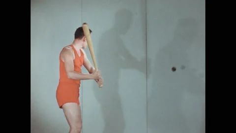 1940s: Man with bat hitting ball on string. Clapboard. 库存影片 168263319