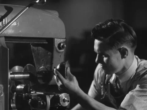 1940s: Man oils machine Stock Footage 231722995