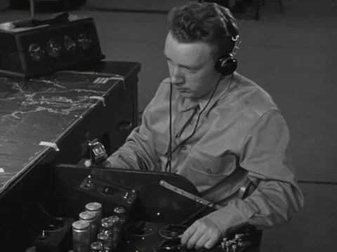 1940s: Man operating machine Stock Footage 231713012