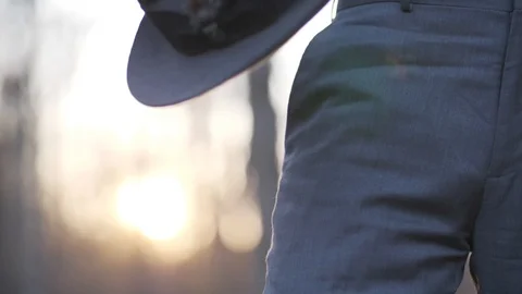 1940s man takes off hat at sunset Stock Footage 107322438