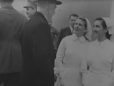 1940s: Man talks with nurses shipside Stock Footage 229725927
