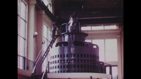 1940s: Man on turbine / Man at control panel / Power lines / Power station Vídeo Stock 74635348