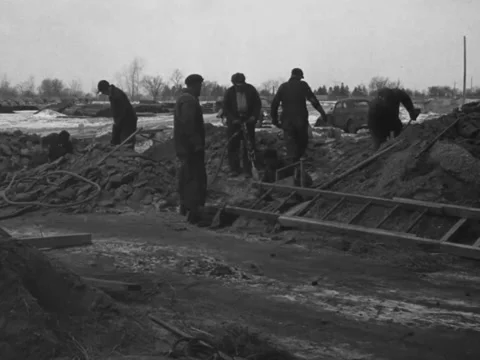 1940s: Man uses jackhammer Stock Footage 231427273