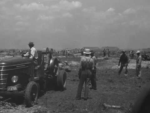1940s: Man in vehicle using winch Stock Footage 231734650
