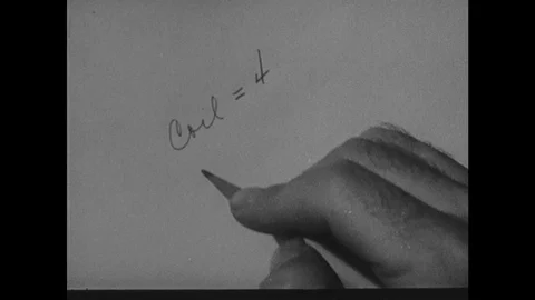 1940s: Man writes on paper, adds numbers, looks confused. Stock Footage 114677992