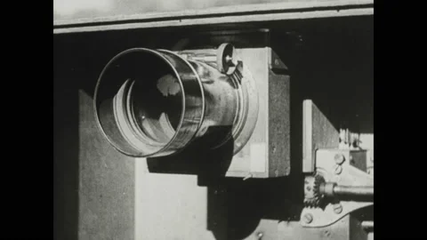 1940s: Marey's assistant sets up the chronophotography camera, adjusting the Stock Footage 130359281