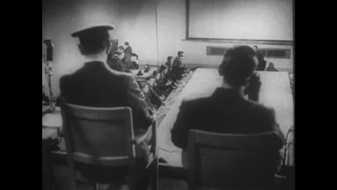 1940s: men look at map in control station. Men in fighter station. Men receive Stock Footage 75149511