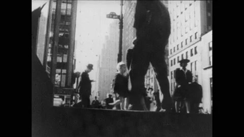 1940s: Men mining. Crowds of people. People walking into doorway. Kids playing Stock Footage 160133267