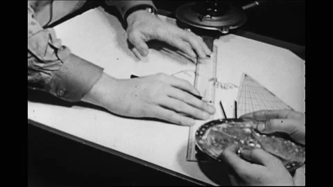 1940s: Men plot lines on nautical chart.  Man looks into periscope.  Submarine Vídeos de archivo 167370235