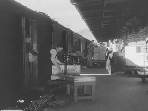1940s: Men unloading boxes from train Stock Footage 231717466