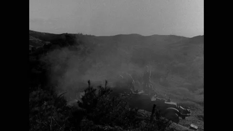 1940s: Mortars explode on mountainside. Soldiers on military vehicle duck in Stock Footage 158449739