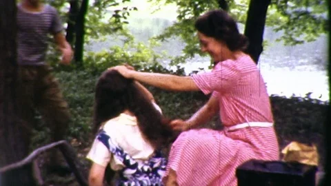 1940s Mother Mom Combs Daughter's Hair Loving Care Vintage Old Film Home Movie Stock Footage