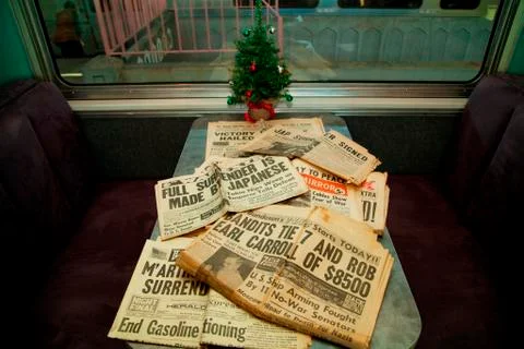 1940s Newspaper headlines are displayed on the Pearl Harbor Day Troop train Stock Photos