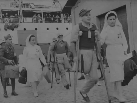 1940s: Nurses help German casualties onto ship Video stock 229725937