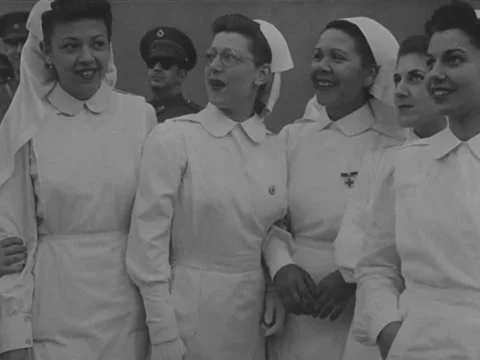 1940s: Nurses stand around chatting Video stock 229726496