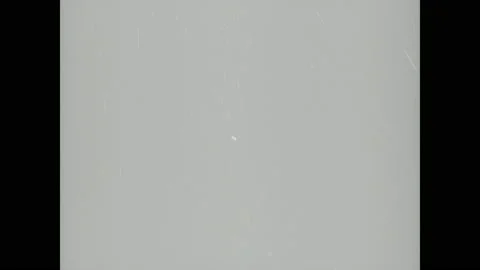 1940s: Objects shoot up into air. Dark cloud explodes in the air. 動画素材 138335091