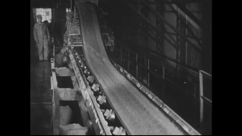 1940s: Ore travels on conveyor belt. Machine separates ore from lead. Stock Footage